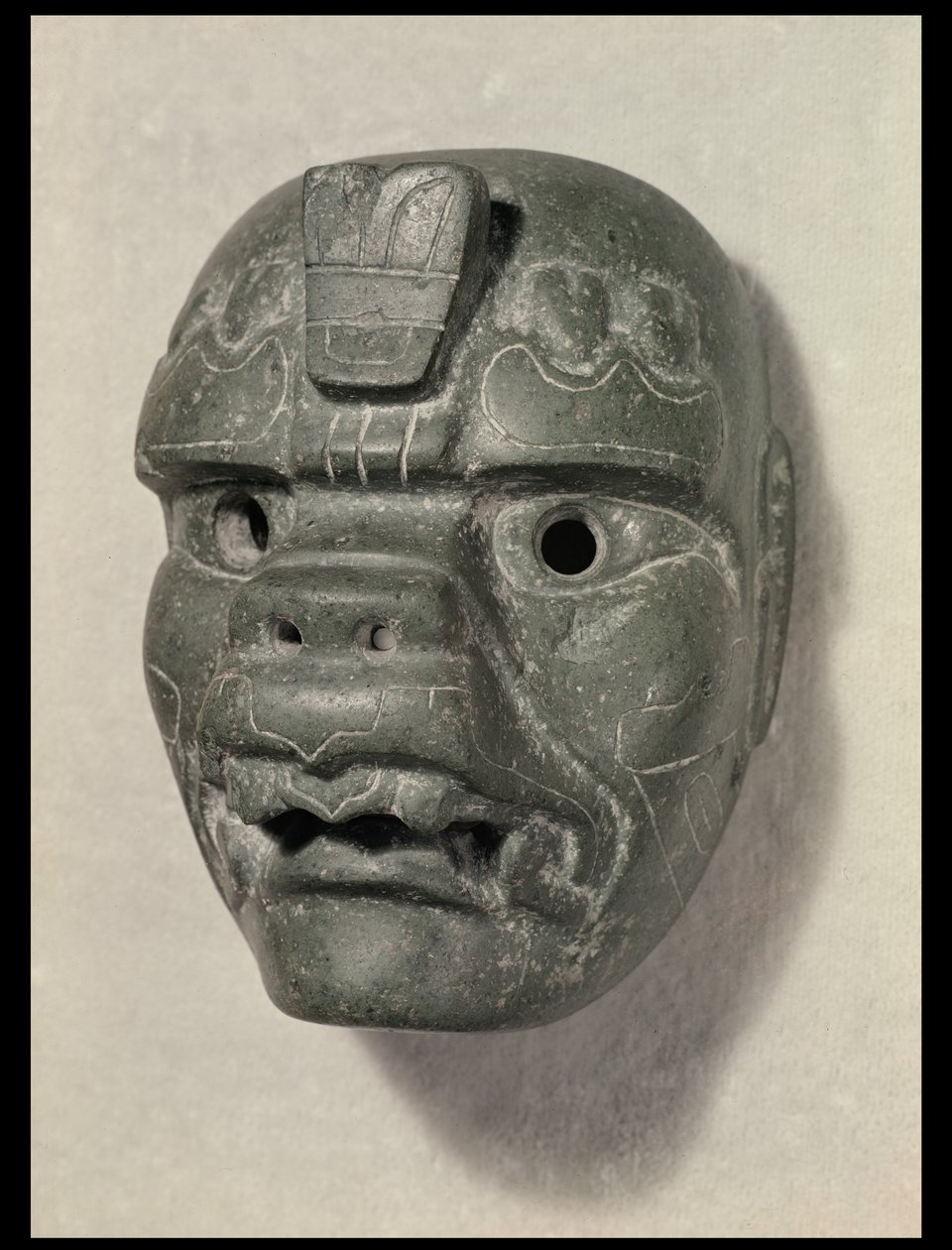 Máscara felina de um homem, de Oaxaca, pré-colombiana (jade) de Mexican School