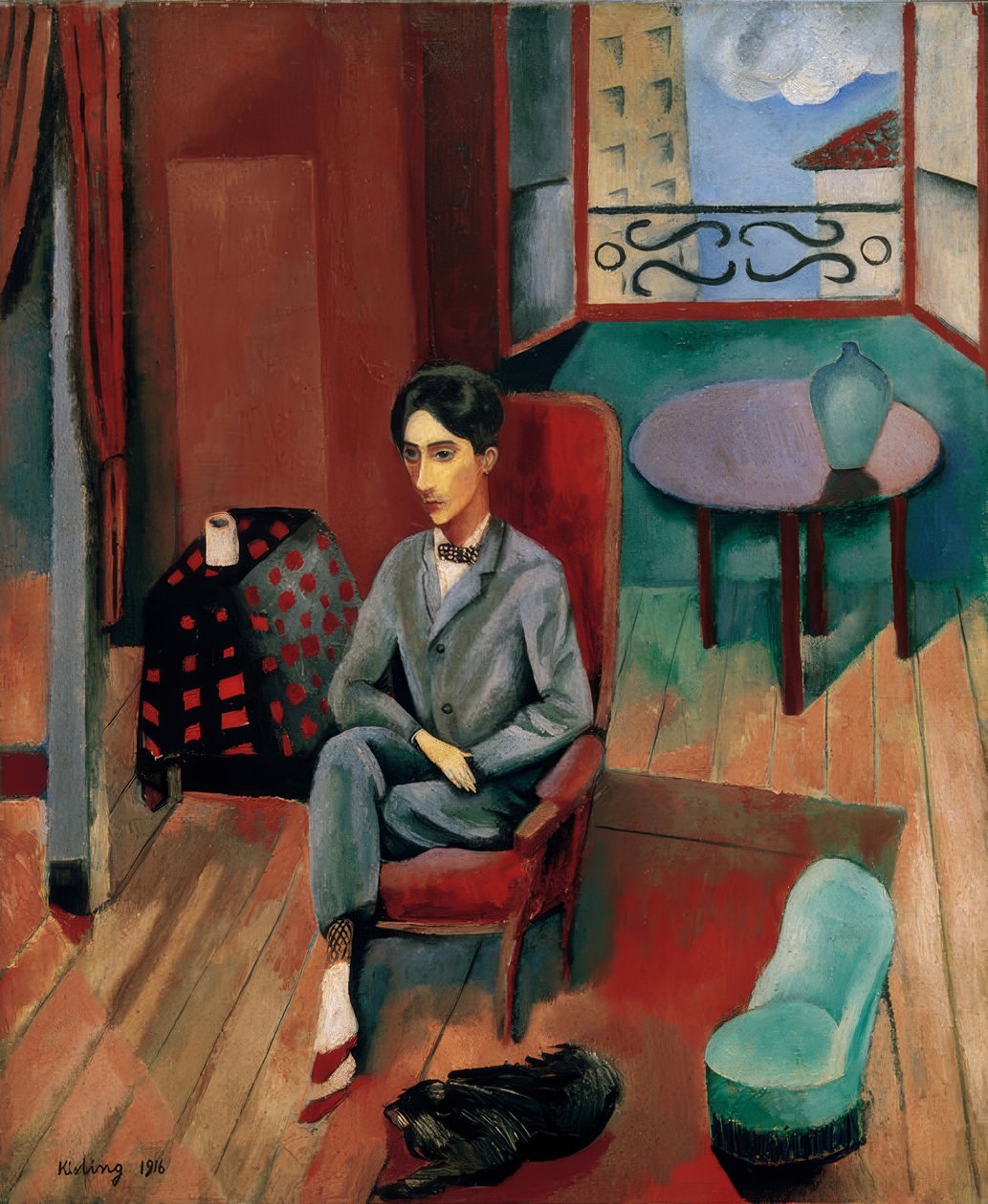 Jean Cocteau sentado no seu estúdio de Moise Kisling