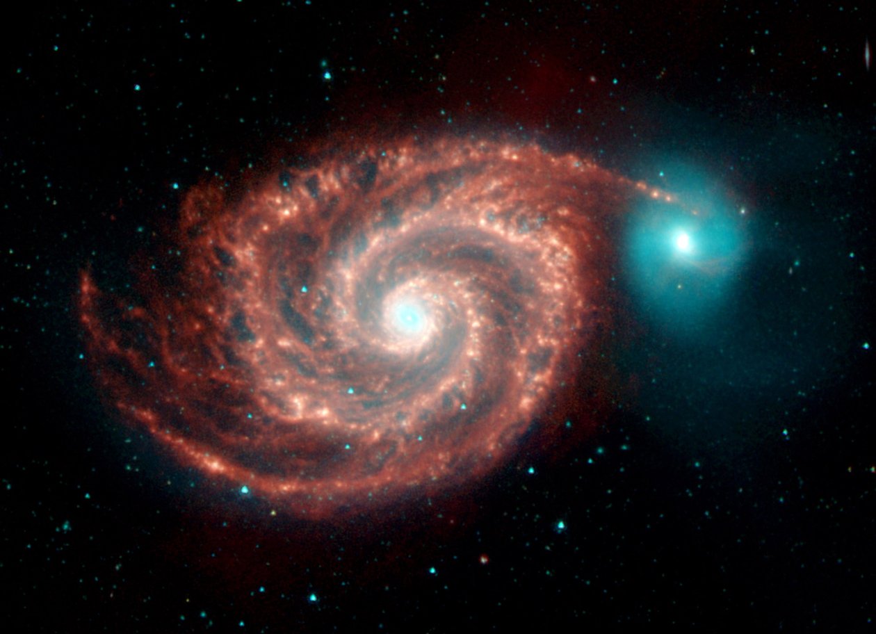 Imagem infravermelha do telescópio espacial de Spitzer da galáxia do redemoinho. Estranhas estruturas atravessam as lacunas entre os braços espirais ricos em poeira e mostram as populações de poeira, gás e estelar na galáxia espiral brilhante. Cr de National Aeronautics and Space Administration National Aeronautics and Space Administration