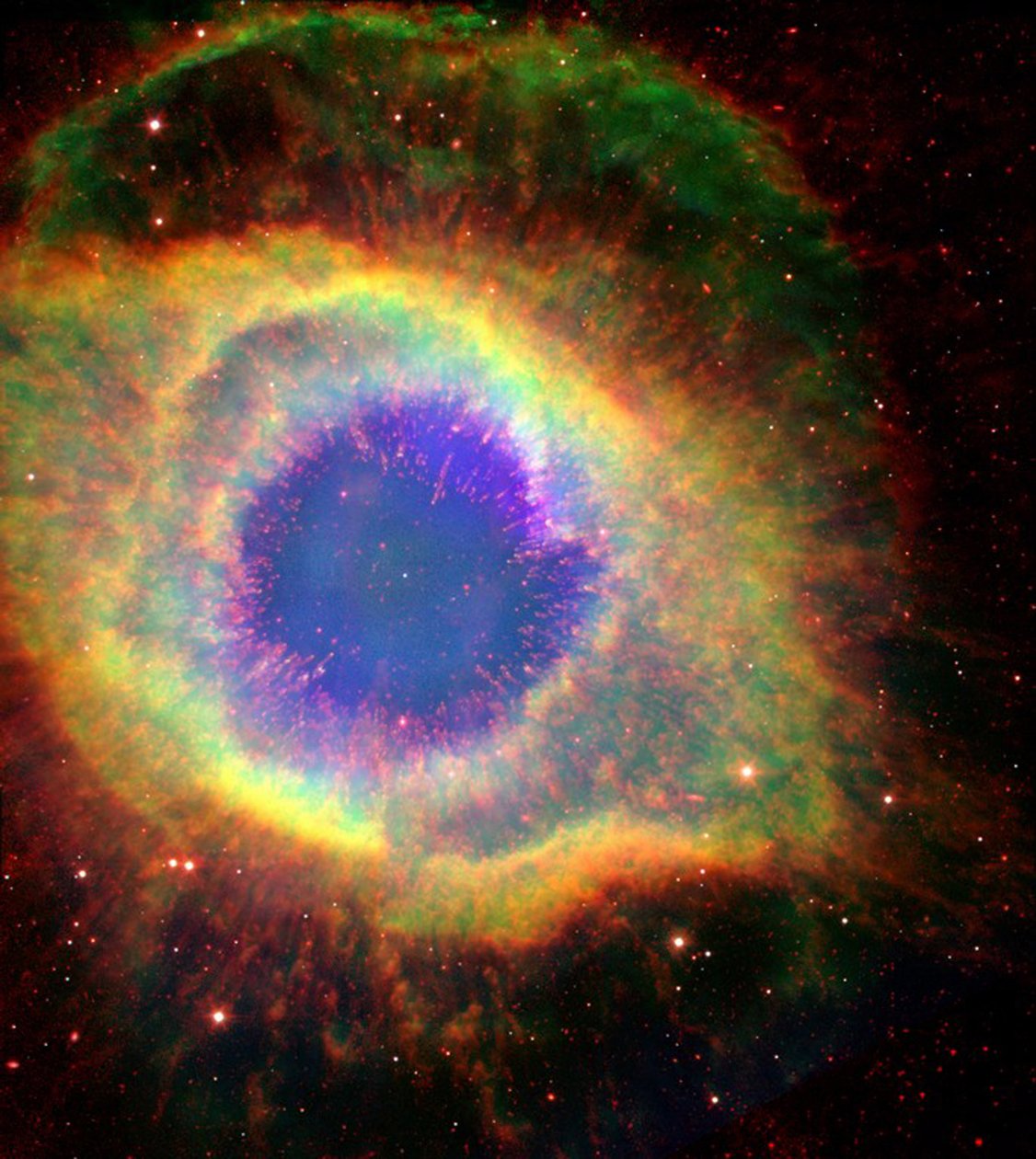 A Nebulosa da Hélice (NGC 7293), às vezes chamada O Olho de Deus, uma grande nebulosa planetária na constelação de Aquário. Crédito: NASA. de National Aeronautics and Space Administration National Aeronautics and Space Administration