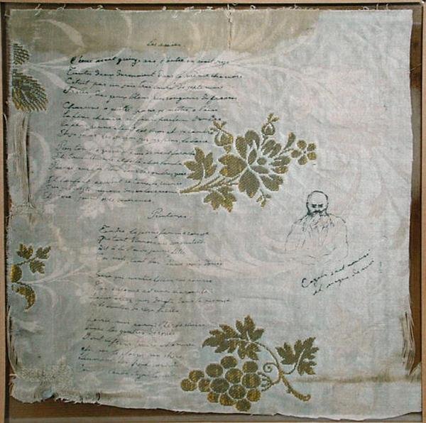 Pedaço de toalha de mesa em que Verlaine escreveu seus poemas 