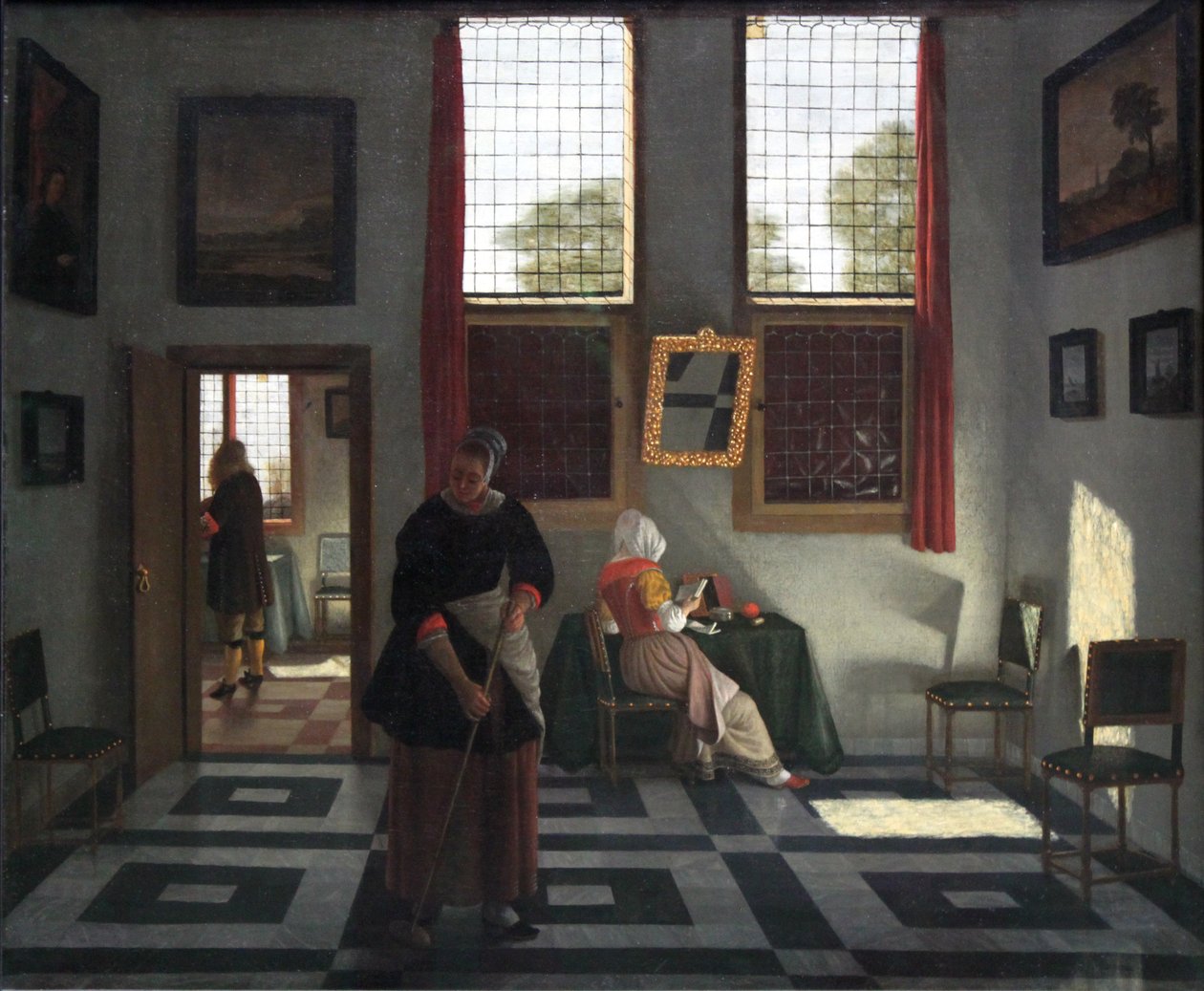 Interior com pintor, lendo a senhora e empregada de limpeza de Pieter Janssens