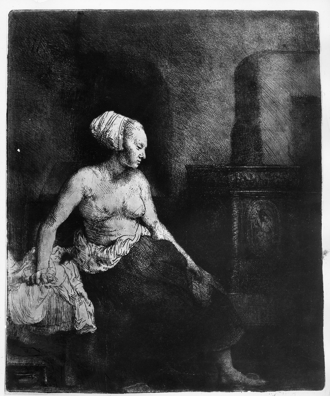 Mulher sentada meio vestida ao lado de um fogão, 1658 de Rembrandt van Rijn