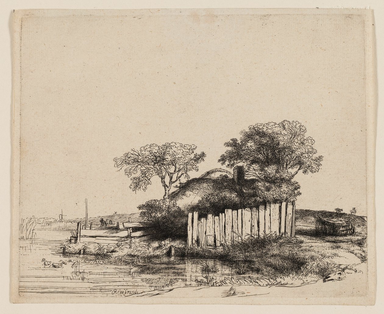 Uma casa de campo com paliçada branca de Rembrandt van Rijn