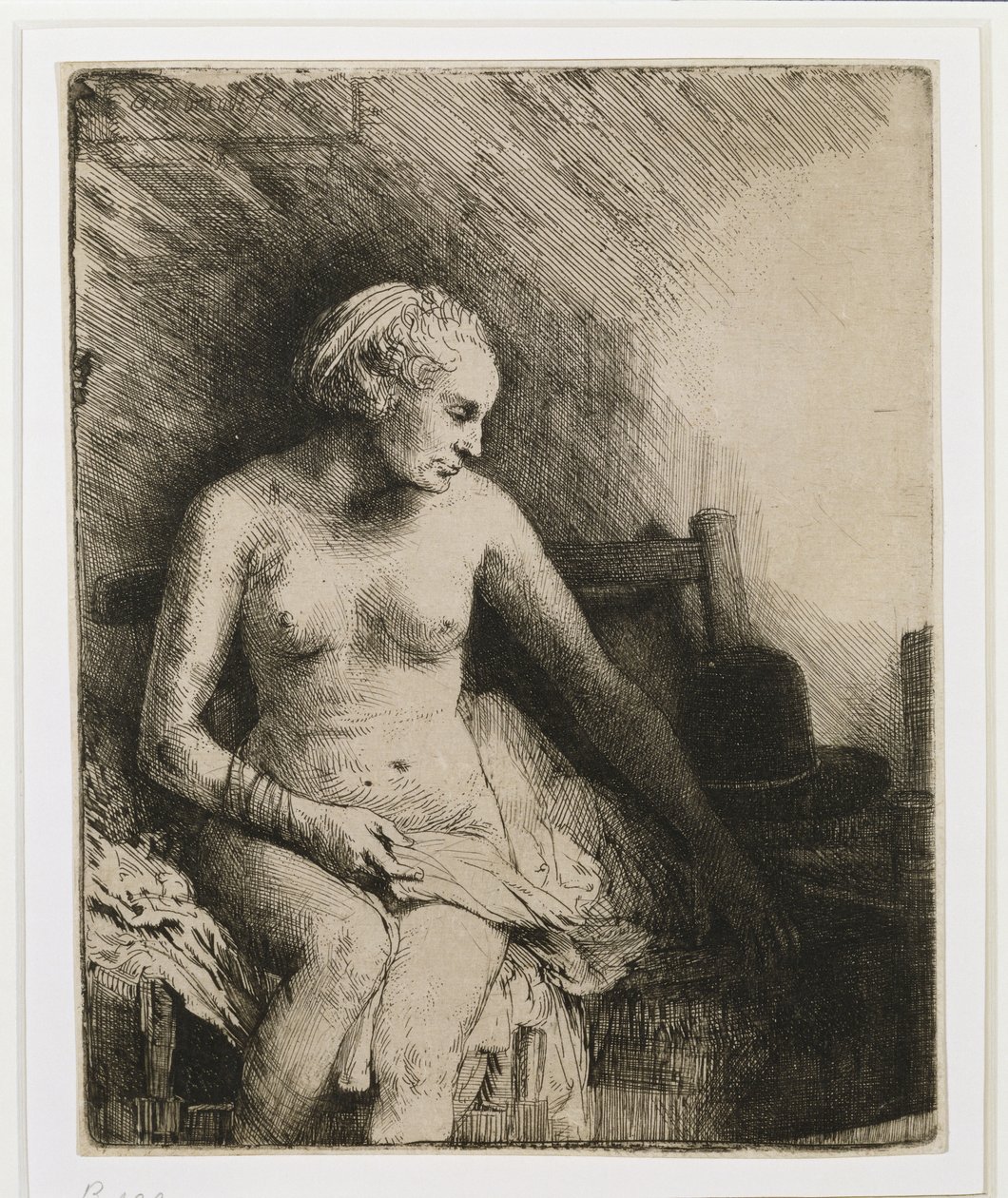 Uma mulher no banho com um chapéu ao lado dela, 1658 de Rembrandt van Rijn