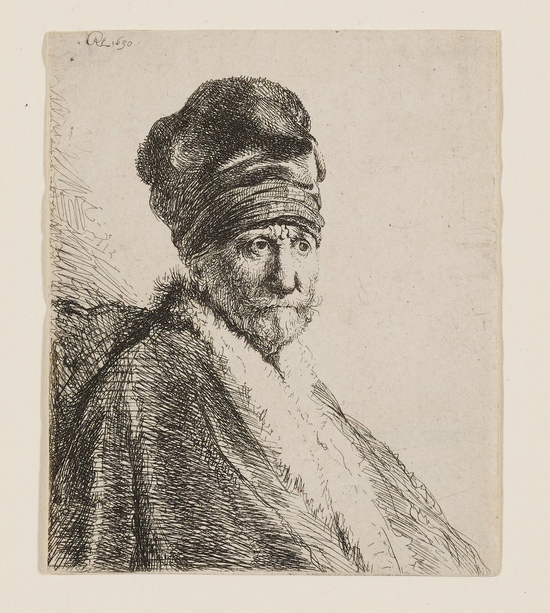 Busto de um homem com um boné de pala alta de Rembrandt van Rijn