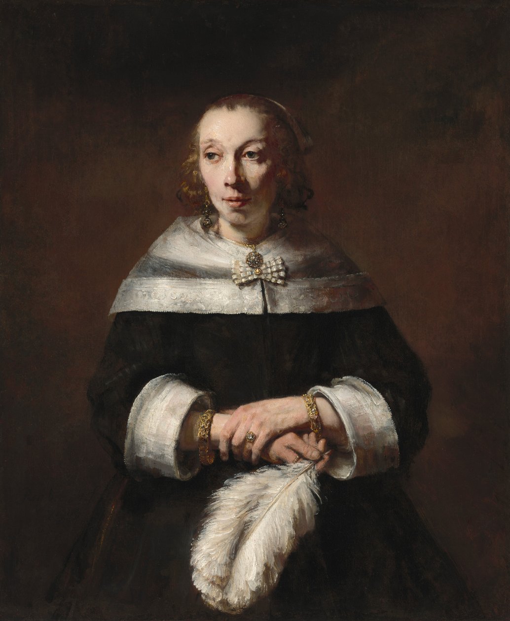 Retrato de uma senhora com um leque de penas de avestruz, c. 16561658. de Rembrandt van Rijn