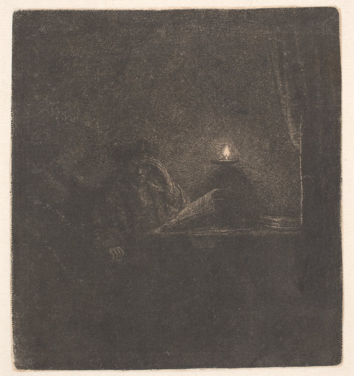 Estudante sentado a uma mesa à luz de uma vela de Rembrandt van Rijn