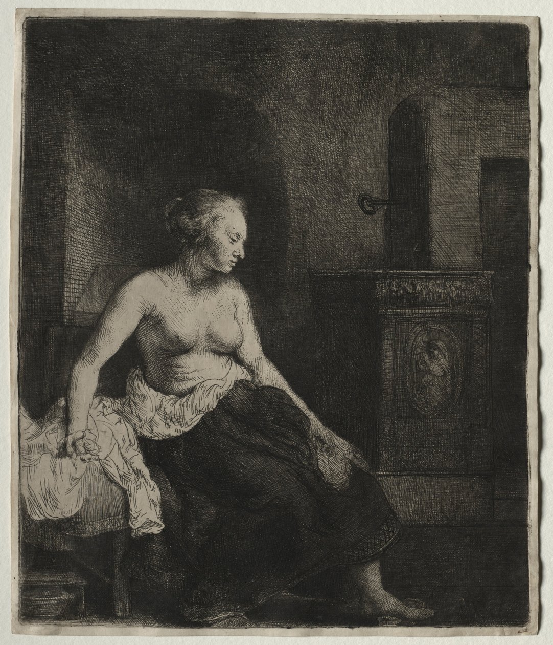 Mulher sentada meio vestida ao lado de um fogão, 1658. de Rembrandt van Rijn
