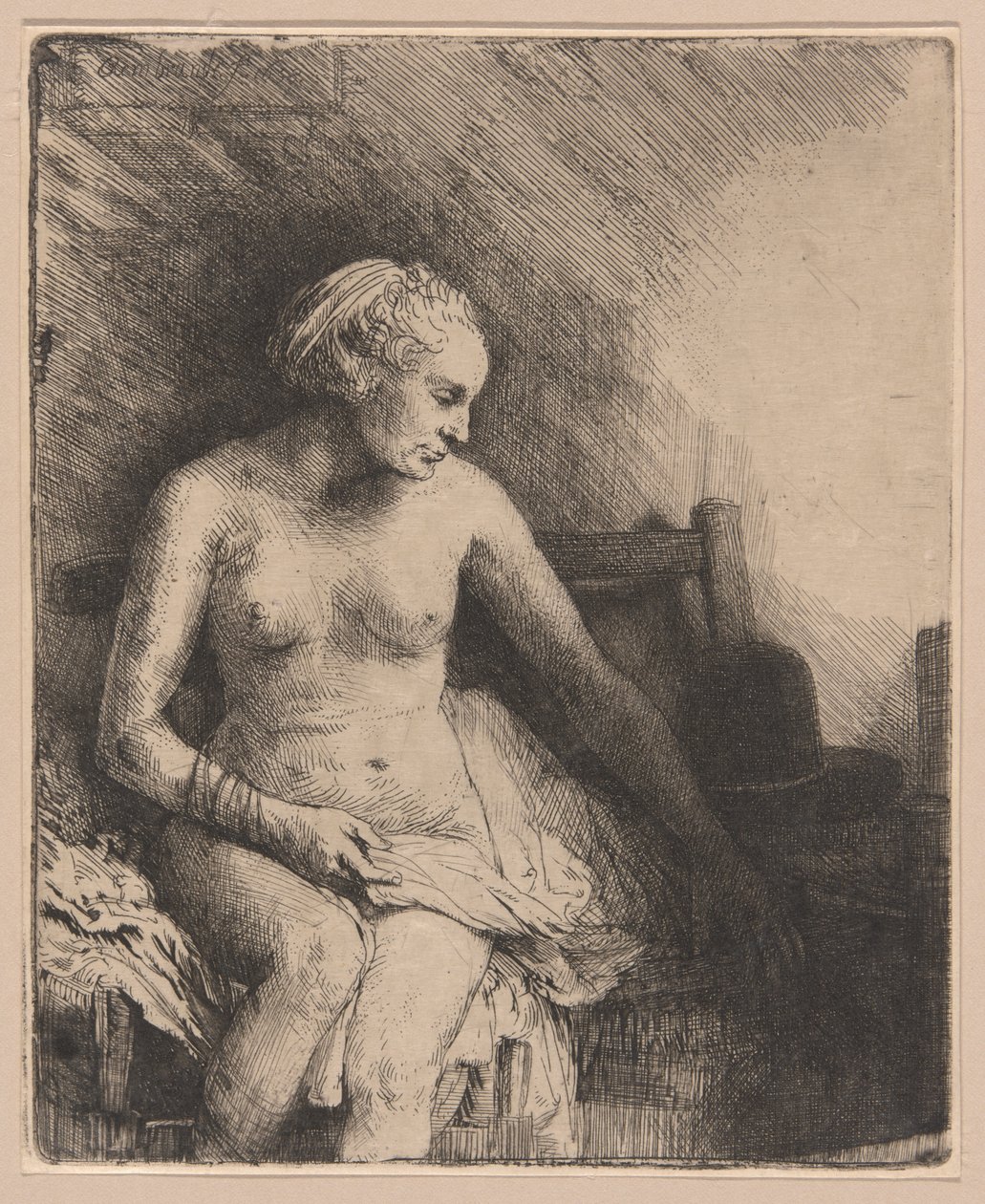 Mulher no banho com um chapéu ao lado dela de Rembrandt van Rijn