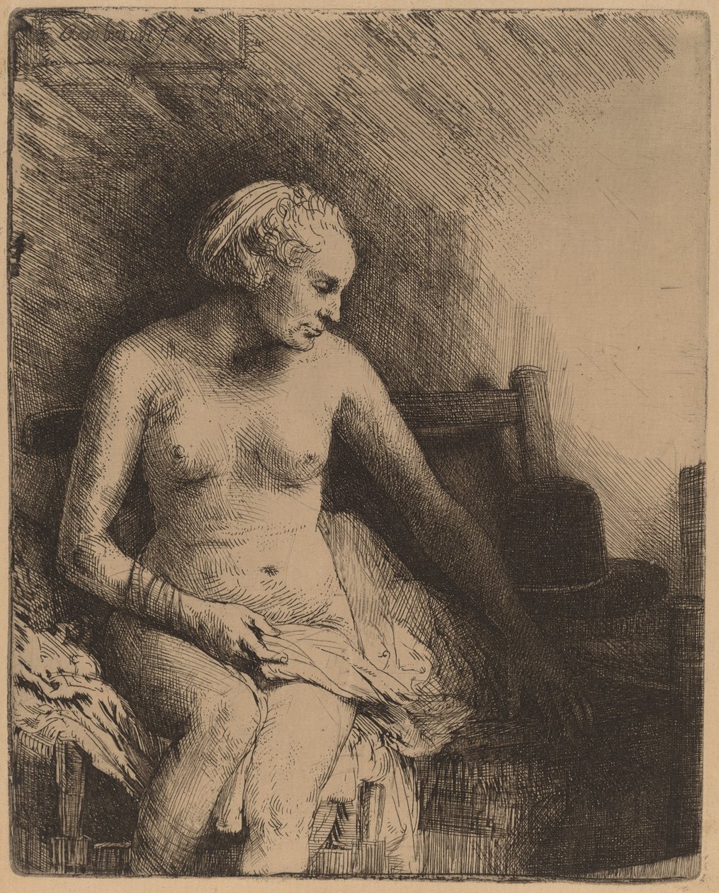 Mulher no banho com um chapéu ao lado dela de Rembrandt van Rijn
