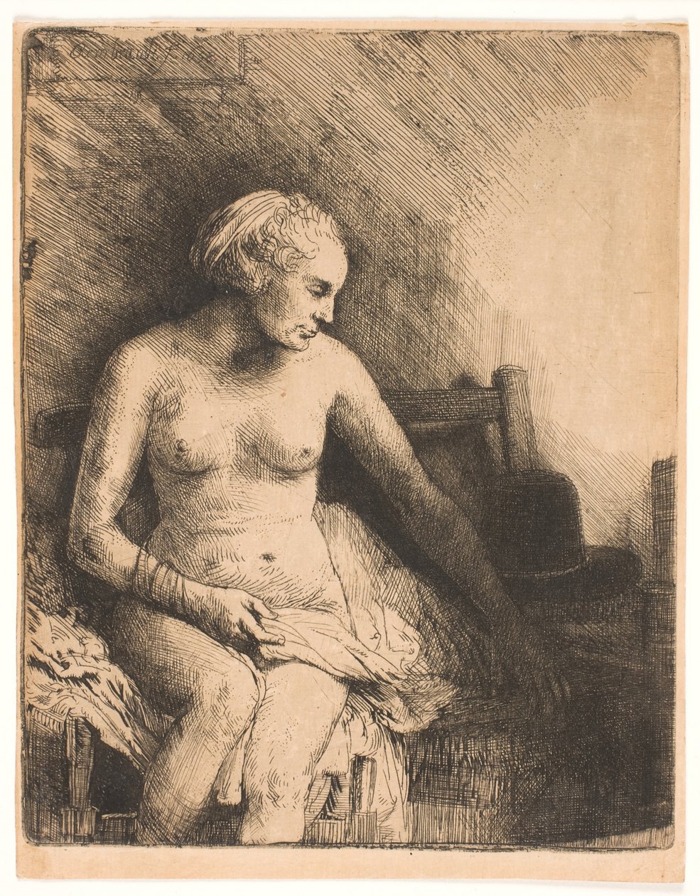 Mulher no banho, com um chapéu ao lado dela de Rembrandt van Rijn
