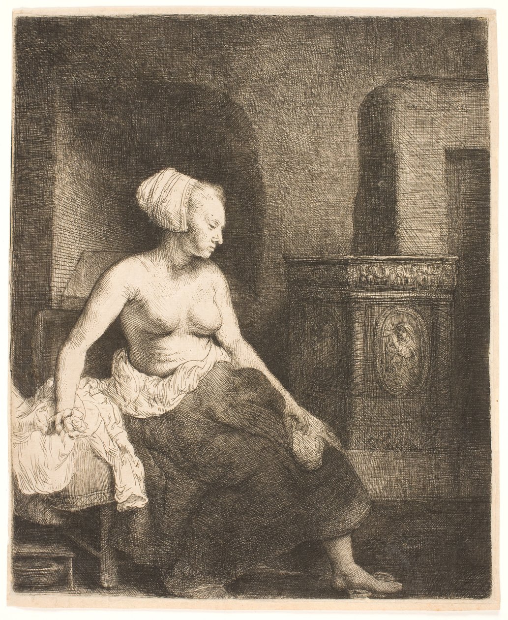 Mulher sentada meio vestida ao lado de um fogão de Rembrandt van Rijn
