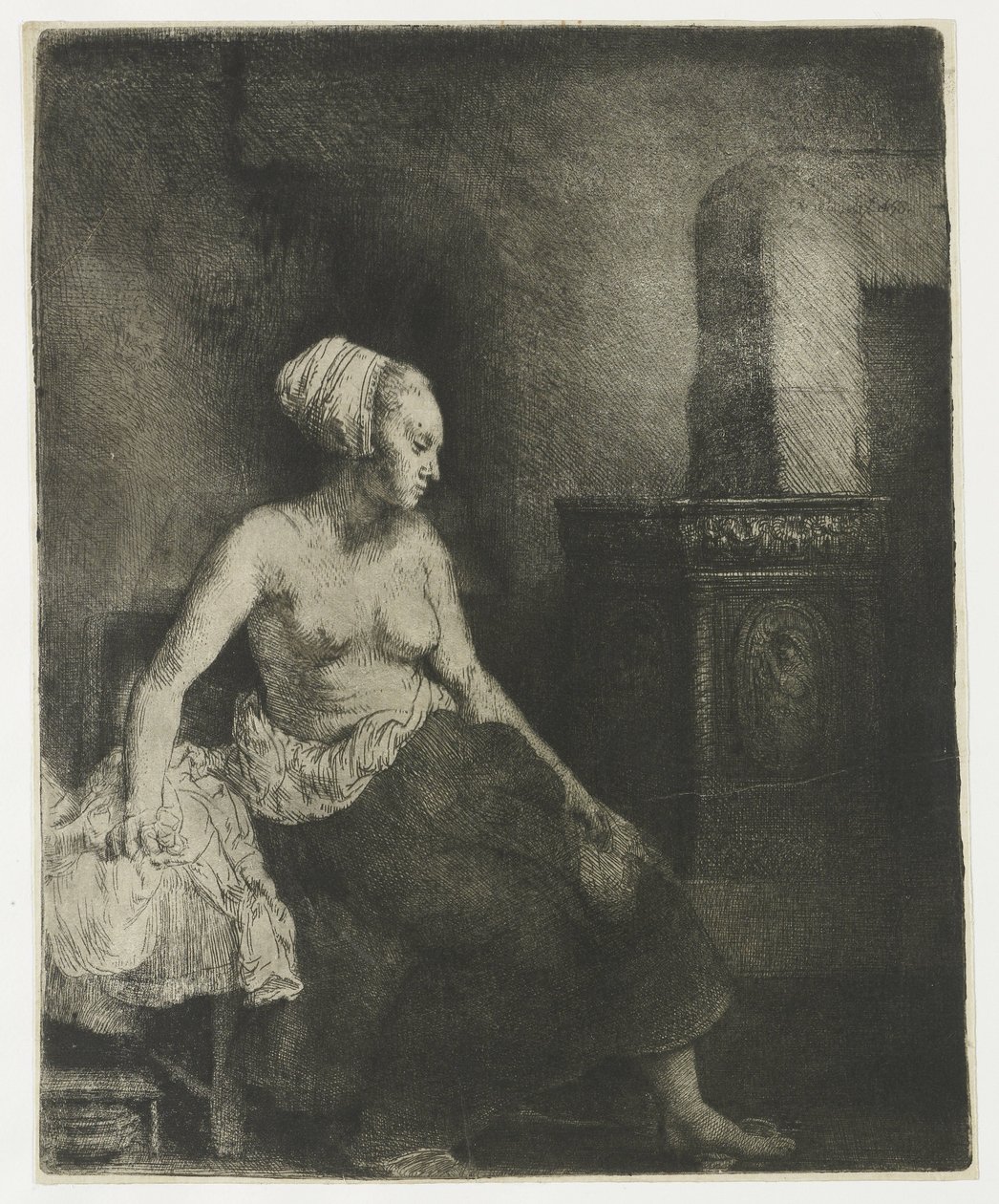Mulher sentada meio vestida ao lado de um fogão de Rembrandt van Rijn