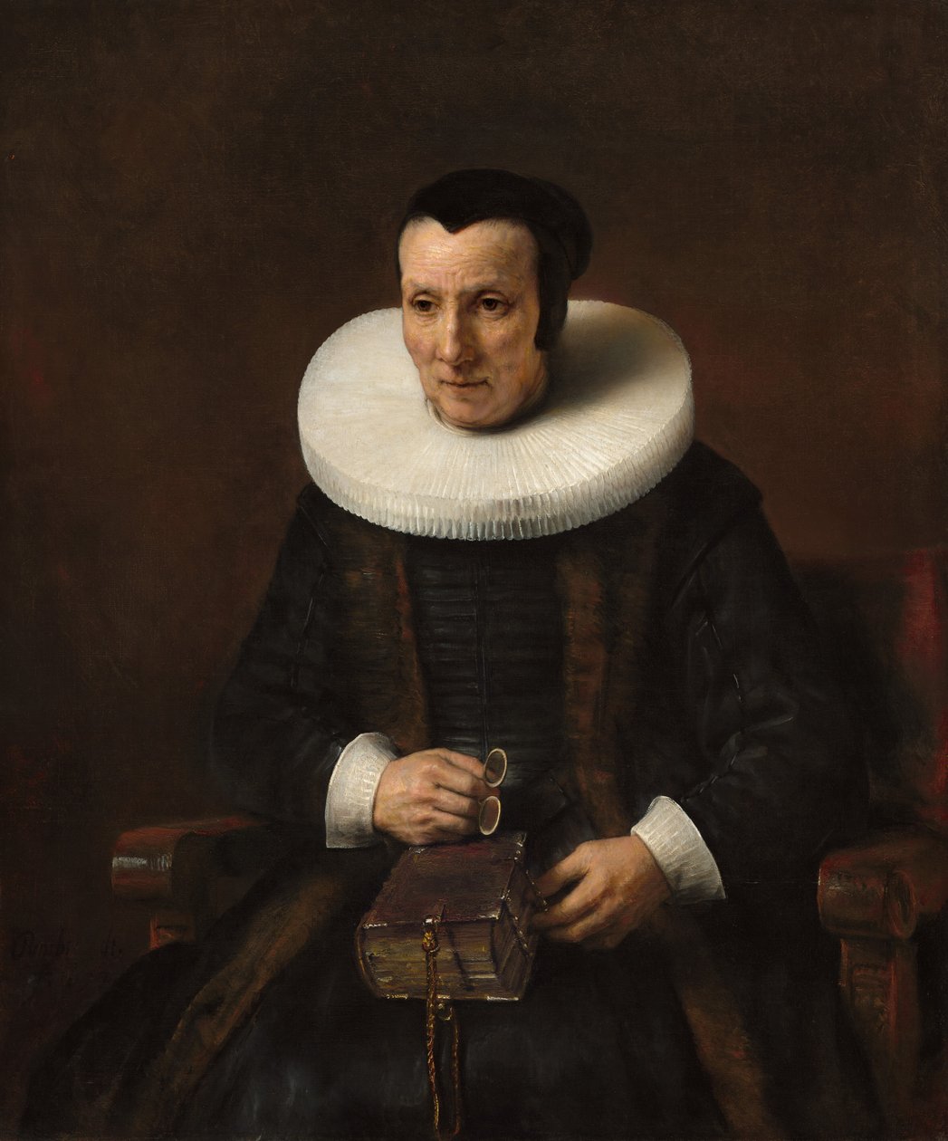 Uma velha senhora com um livro de Rembrandt van Rijn and Workshop