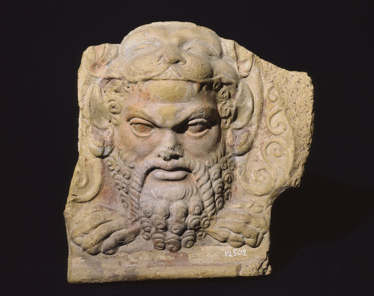 Antefix representando a cabeça de um homem, do Templo de Sassi Caduti em Falerii de Roman