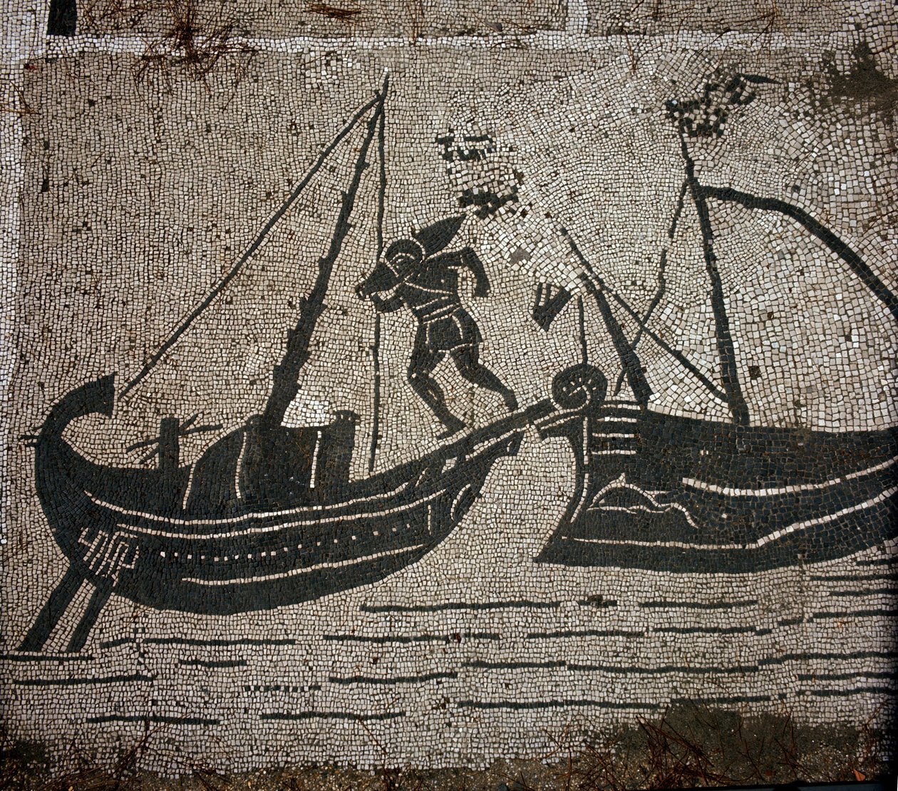 Ostia Antiga (Ostia). Place des Corporations. Mosaico da Sabratha Seafarers Corporation. Carregamento de mercadorias em um navio. de Roman