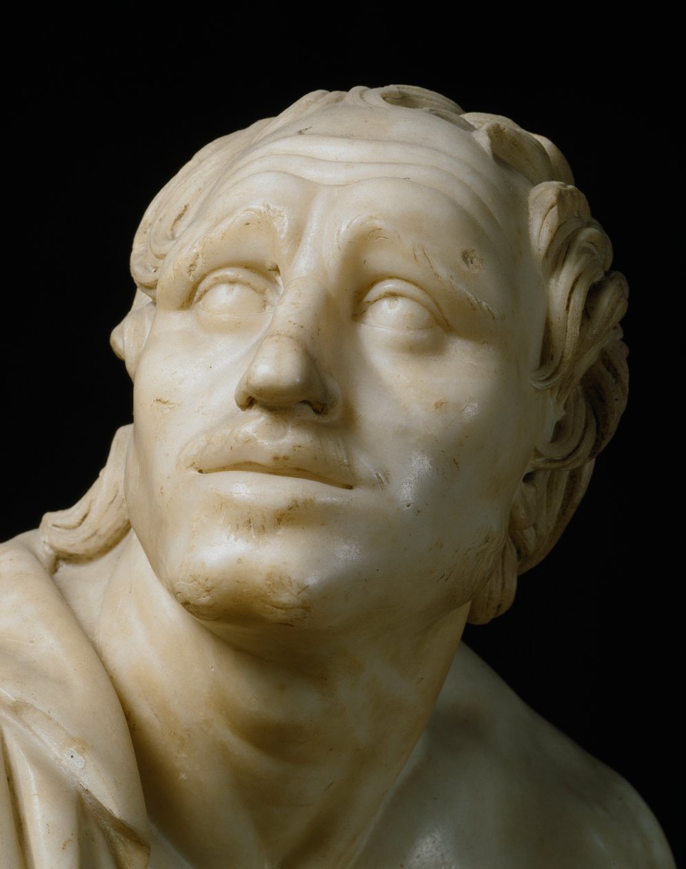 Arte romana: "Um afiador a afiar as suas facas" Detalhe da sua cara. Escultura em mármore romano do século I a.C., depois de um original grego. Dim. 105 cm Florença, Galleria degli Uffizi, Tribuna de Roman