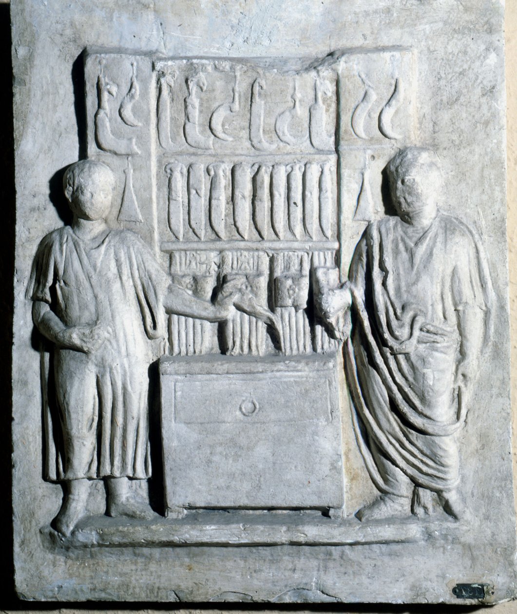 Sinal da loja de facas na era romana. Museo di Ostia (Ostia) de Roman Roman