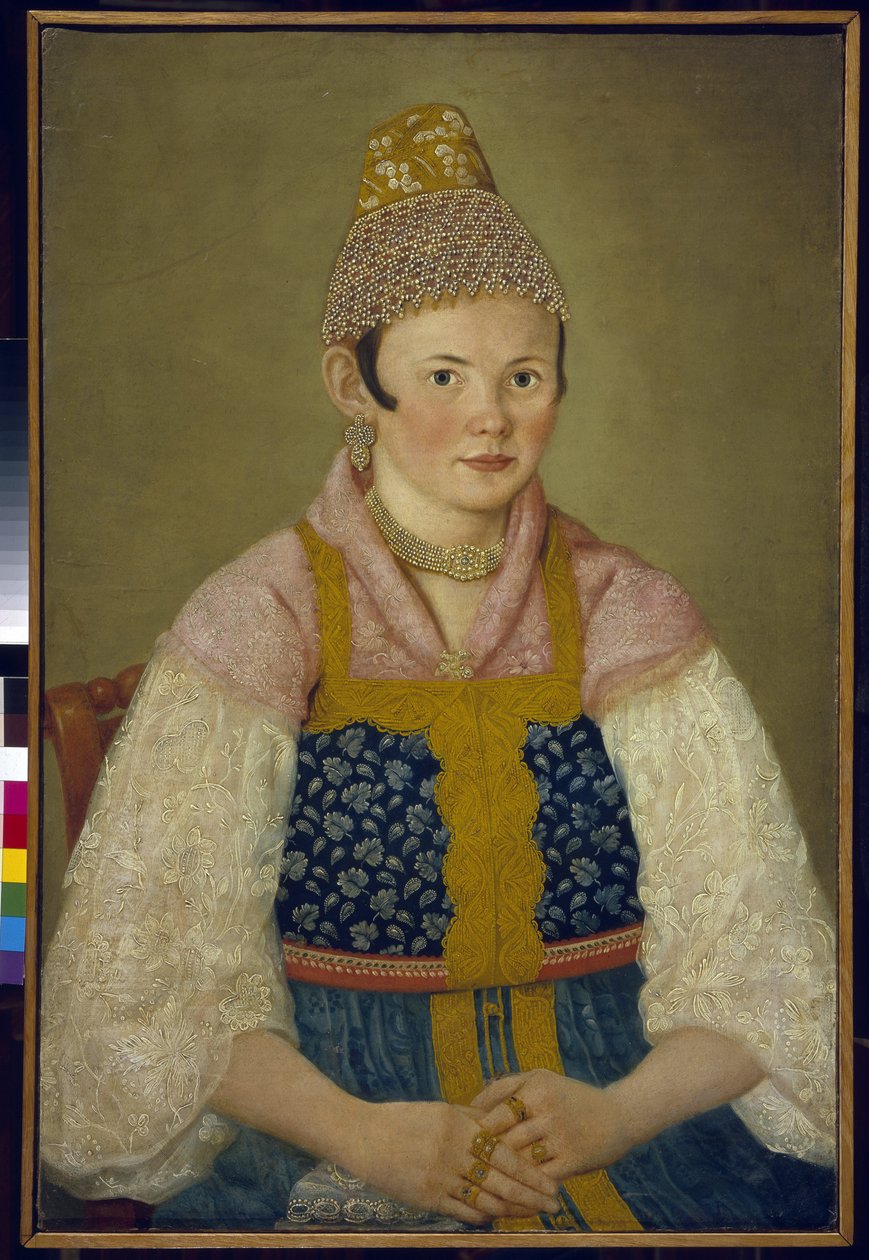 Retrato da esposa de um comerciante, cocar do tradicional kokoshnik. (Retrato de uma Mulher Comerciante em Kokoshnik Kabluchok). Ela também usa o tradicional vestido russo (sarafane) decorado com bordados, com uma blusa com mangas de renda, seu cocar de School Russian