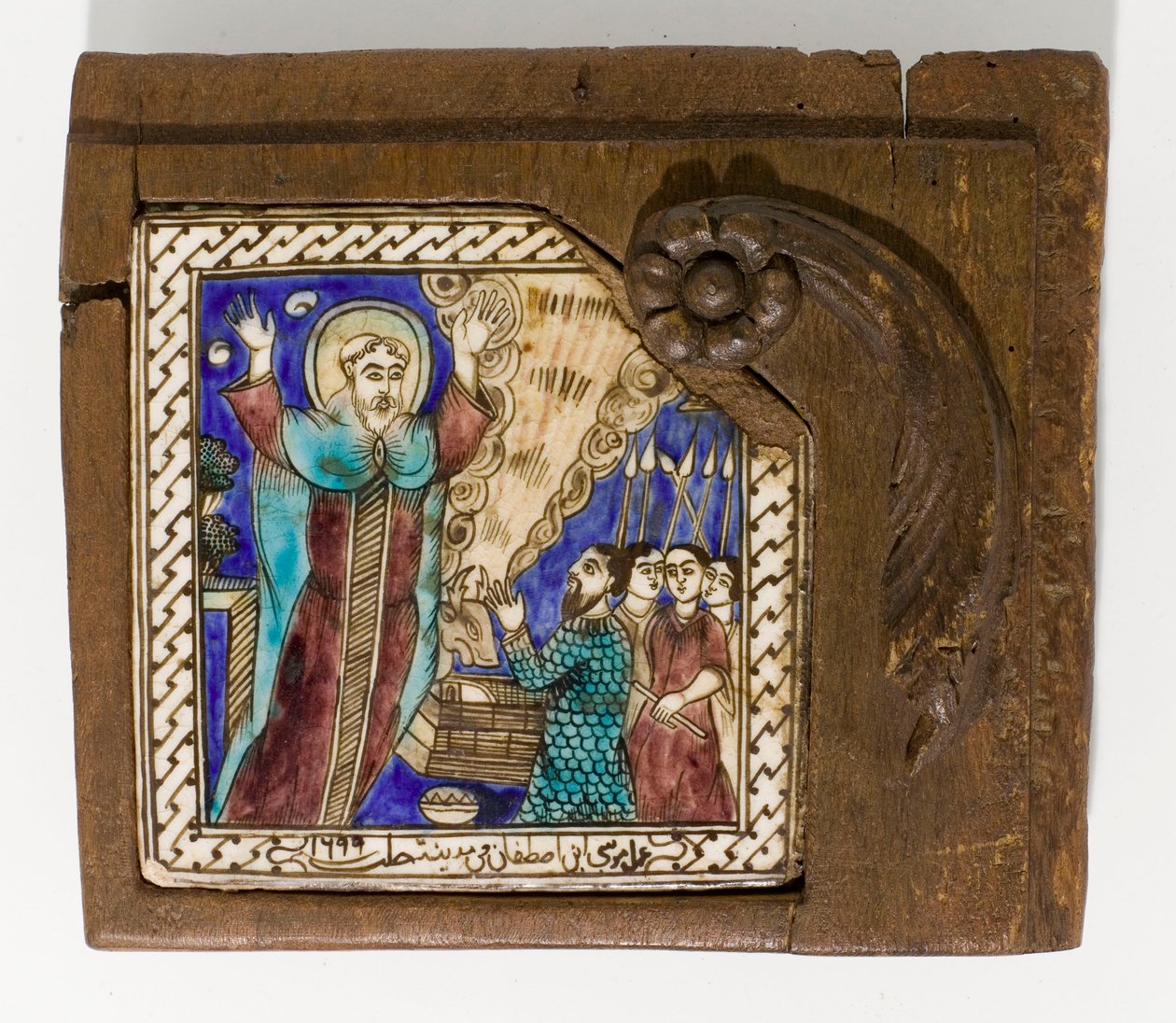 Uma telha de cerâmica síria datada e assinada, pintada em managanese, azul e marrom, datada de 1699, 1699 de Syrian School
