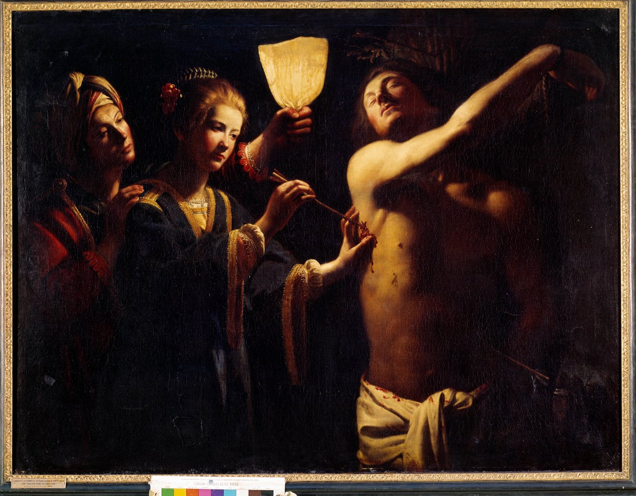 São Sebastião cura por Santa Irene Sebastião após seu primeiro martírio e é tratado pela viúva Irene e sua serva. Pintura por Trophime Bigot conhecida como Le Maitre a la Candelle (século XVII). 1620-1630. Dim. 1,29x1,7 m. Bordeaux, Museu de Fine Ar de Trophime Bigot