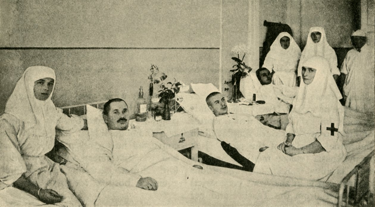 Tsarina Alexandra amamentando soldados feridos, 1914, c1920. de Unbekannt