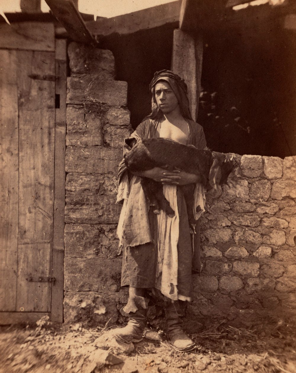 Patre do Líbano com uma criança. Fotografia de Charles Lallemand (1826-1904) em "Syria, costumes, viagens e paisagens". 1865. Coleção particular. de Unbekannter Künstler