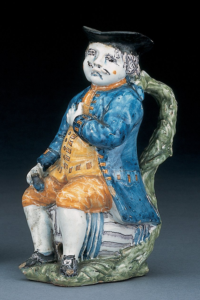 Jarro Toby com rosto e mãos pálidos de manganês, segurando e vazio o jarro globular de cor lustrosa no casaco azul lavado e calções e colete verde, c.1800 de Unbekannt