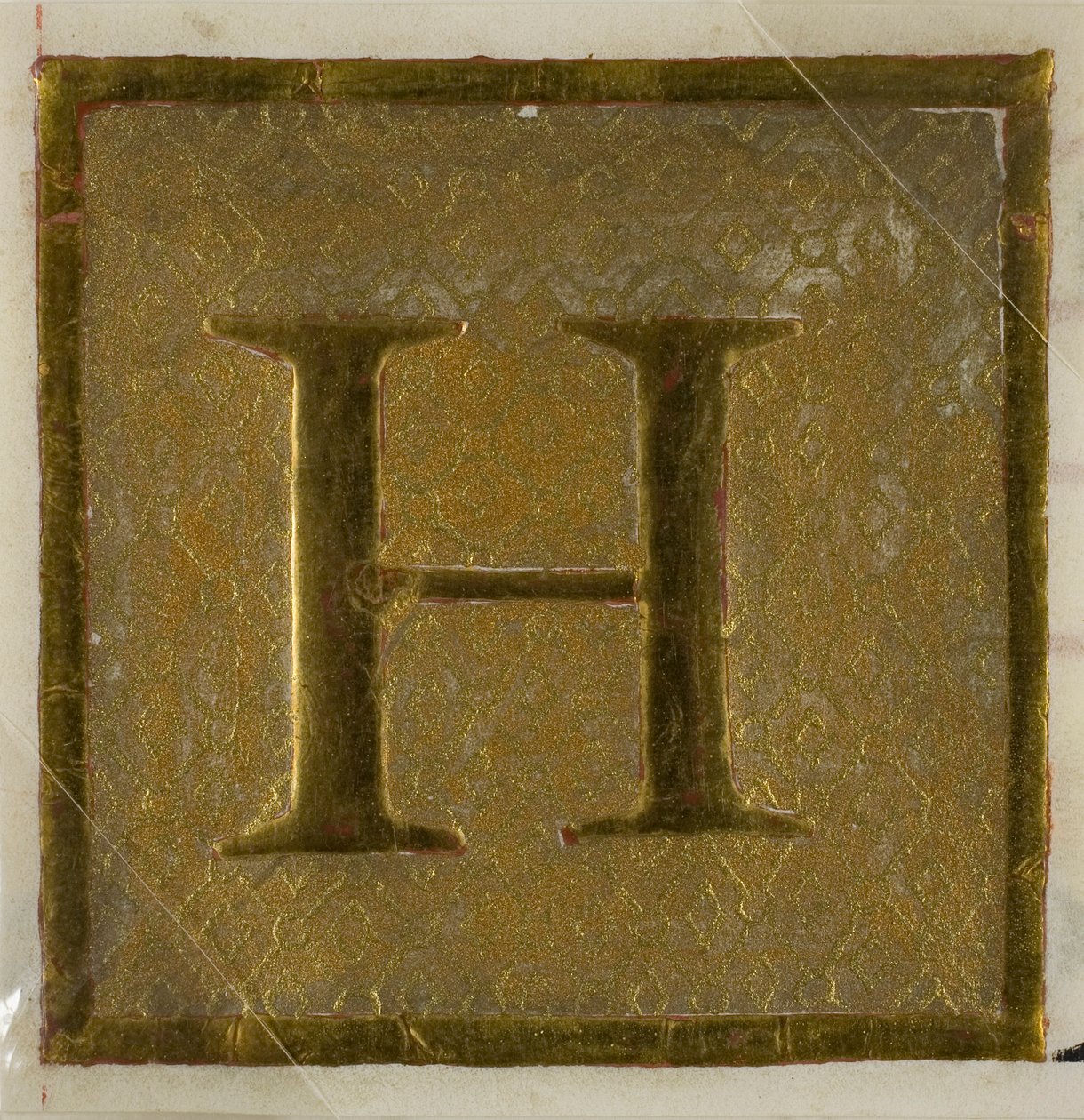 Inicial "H" iluminada num padrão de fralda de um livro de coro de Unknown artist