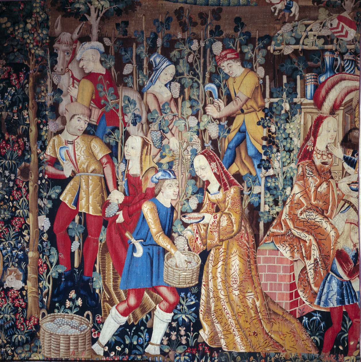Os camponeses da vindima a prensar uvas. Detalhe. A tapeçaria de lã e seda. O início do século XVI. Paris, Museu Nacional da Idade Média, Termas de Cluny. de Unknown artist