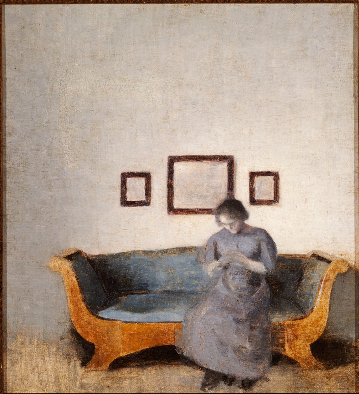 Ida Hammershoi sentado em um sofá de Vilhelm Hammershoi