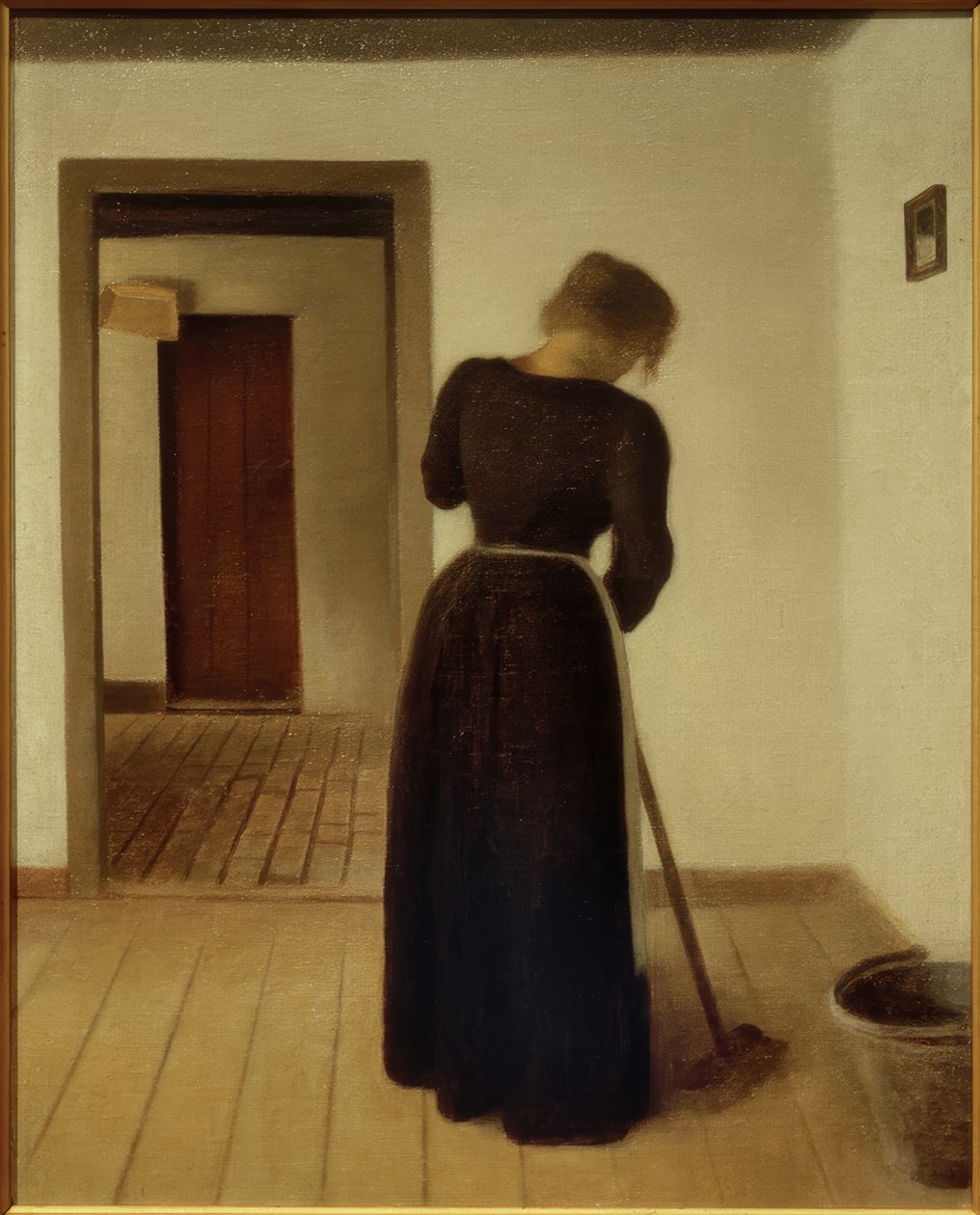 Interior com uma jovem mulher varrendo de Vilhelm Hammershoi