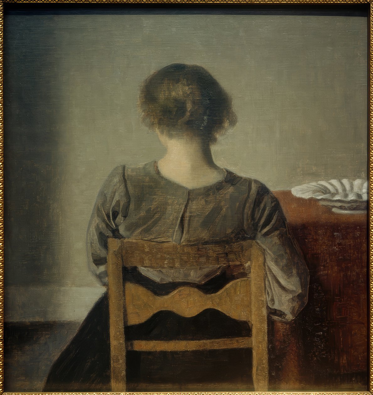 Mulher jovem pausa de Vilhelm Hammershoi