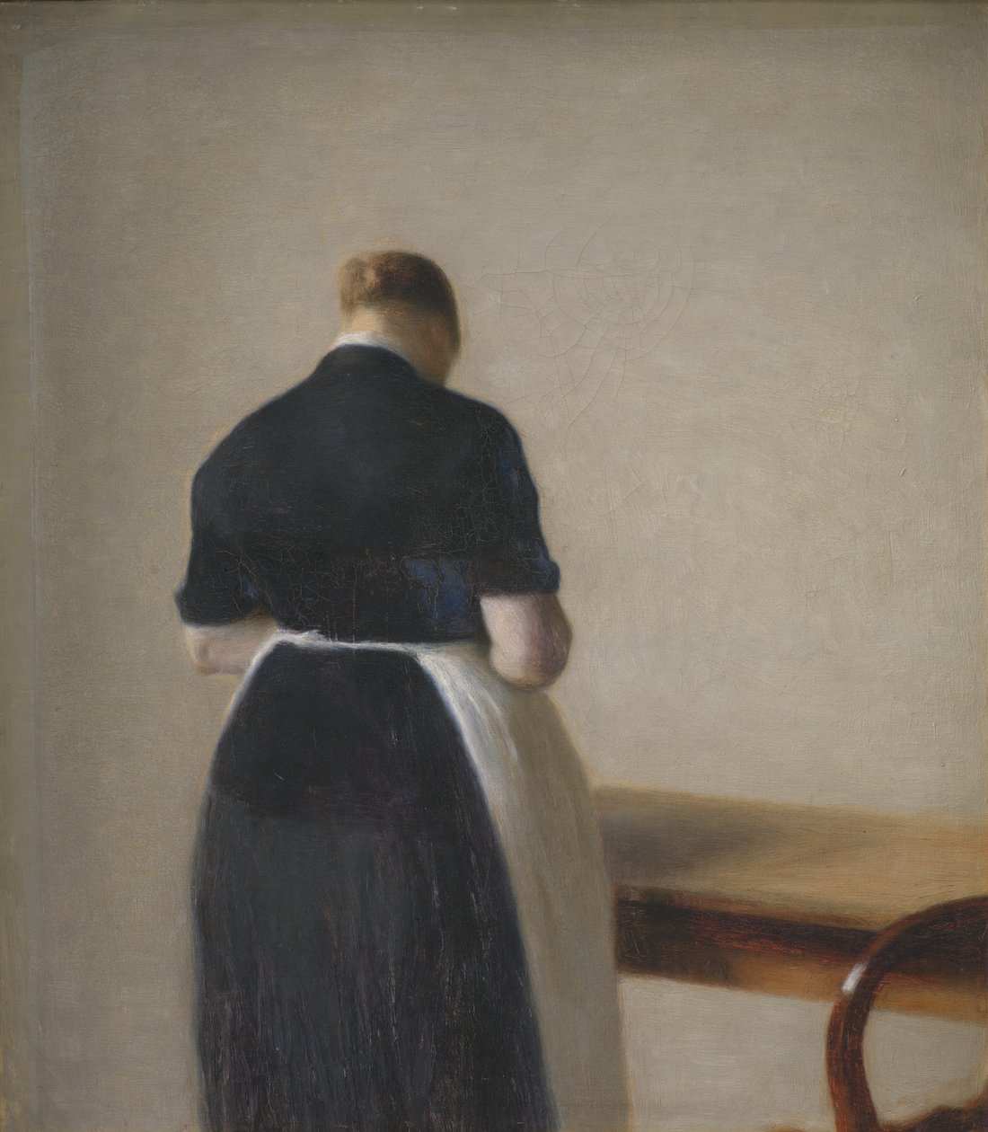 Mulher vista de costas de Vilhelm Hammershøi