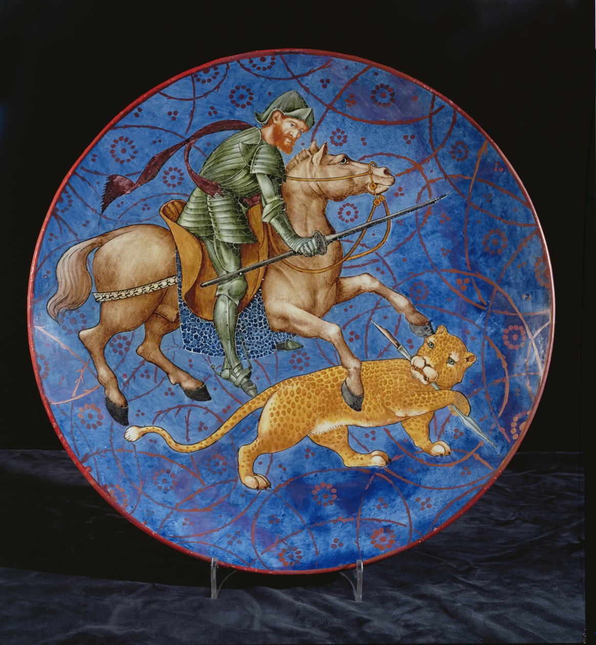 Carregador com um cavaleiro montado tentando lançar um leopardo (cerâmica) de William de Morgan
