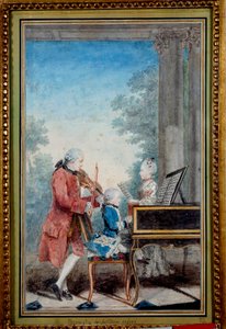 Wolfgang Amadeus Mozart (1756-1791) quando criança tocando piano com seu pai e sua irmã