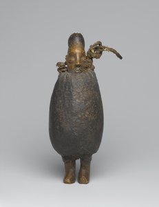 Figura Yaka (madeira, tecido, casca, fibra e materiais orgânicos)