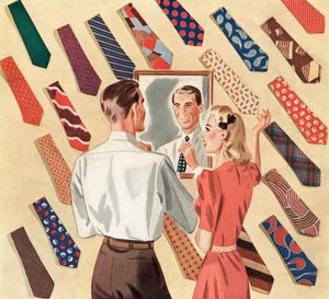 Homem endireita a gravata ao espelho no meio de uma exposição de muitas gravatas de homem de American School