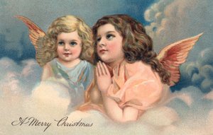 Dois anjos de Natal em oração de American School