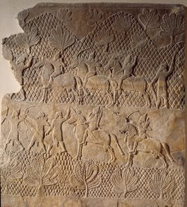 Arte oriental da antiguidade: cena de batalha. Baixo relevo do Palácio Assurbanipal, Assíria (século VII a.C.). Paris, Musee Du Louvre de Assyrian
