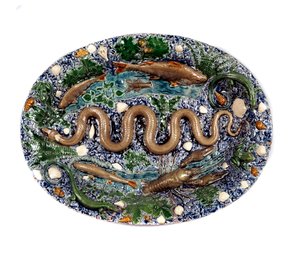 A lagoa decora figuras rústicas chamadas "o prato da cobra". Cerâmica em terra vidrada por Bernard Palissy (1510-1589)
