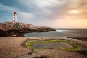 Pôr-do-sol no farol costeiro de Christoph Schaarschmidt