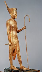 Estatueta do rei vestindo a coroa vermelha do norte, do túmulo de Tutancâmon (c.1370-52 aC) Novo Reino (madeira dourada)