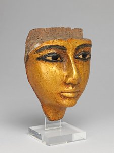 Rosto de um caixão, com olhos e sobrancelhas incrustados, dourados de Egyptian 20th Dynasty