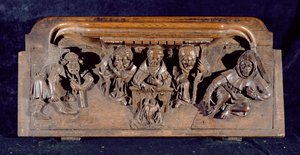Um misericordioso representando um acadêmico sentado em uma mesa de painel entregando uma admoestação a um penitente ajoelhado, New College Chapel, Oxford, final do século XIV (madeira)