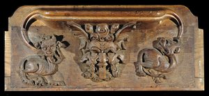 Um misericordioso retratando três rostos humanos ladeados por monstros, New College Chapel, Oxford, final do século XIV (madeira)