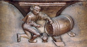 Escultura representando um homem colocando uma torneira em um barril, de uma tenda do coro da Abadia de St. Lucien em Beauvais (madeira) de French School