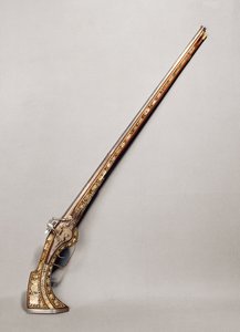 Rifle de pederneira (madeira e metal)