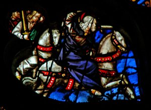 A rosácea oeste retratando uma cena do livro do Apocalipse: Fiel e verdadeiro, o rei dos reis num cavalo branco, com dois outros guerreiros para trás (19: 11-16) de French School